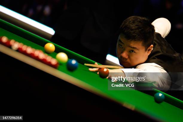 Ding Junhui of China plays a shot in the quarter-final match against Mark Allen of Northern Ireland on day 1 of Tour Championship Snooker 2023 at the...