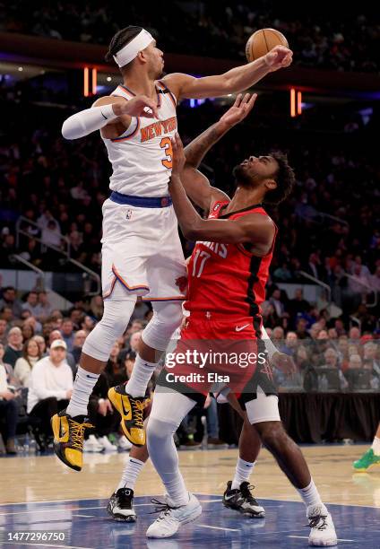 Josh Hart of the New York Knicks blocks a shot by Tari Eason of the Houston Rockets during the first half at Madison Square Garden on March 27, 2023...