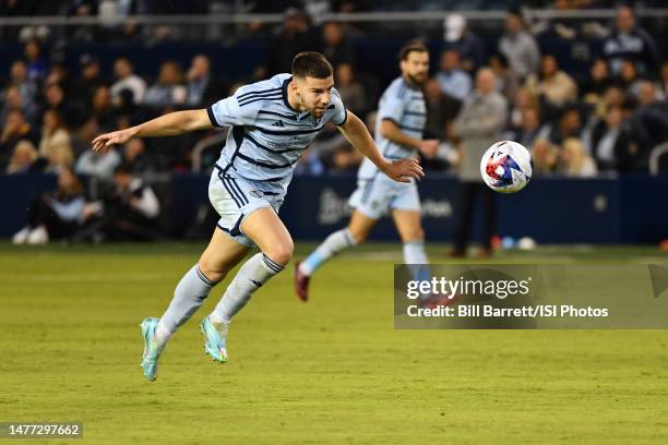 Robert Voloder of Sporting Kansas City heads the ball back to his goalkeeper during a game between Seattle Sounders FC and Sporting Kansas City at...