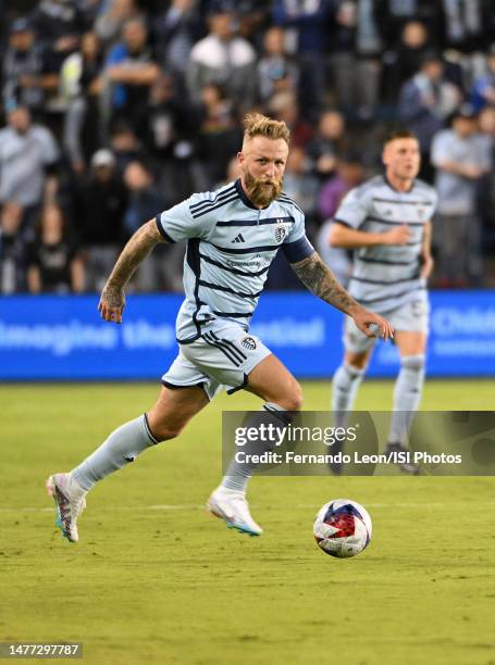 Johnny Russell of Sporting Kansas City tries to propel his team forward in the second half during a game between Seattle Sounders FC and Sporting...