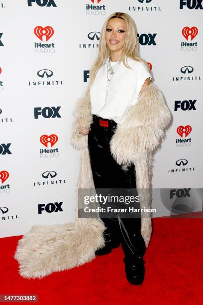 Doja Cat, winner of the Most Played Artist of the Year award and recipient of the iHeartRadio Titanium Award for "Woman," poses in the press room...