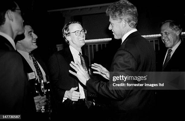 President Bill Clinton and venture capitalist John Doerr attend a... News Photo - Getty Images