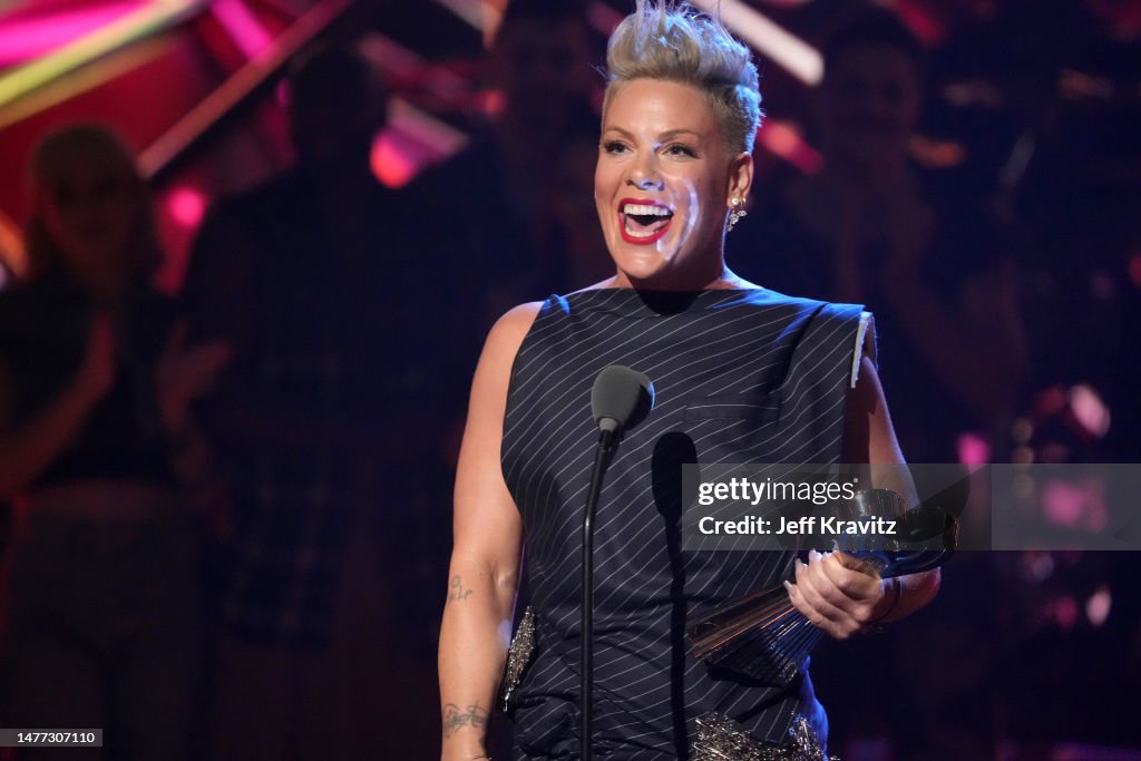 Pink with her 2023 Icon Award on stage at the 2023 iHeartRadio Music