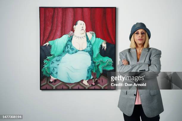 Artist Caroline Zilinsky poses beside her 2023 Archibald entry , a portrait of Drag Queen Maxi Shield titled 'Drama Queen', at Nanda/Hobbs Gallery in...