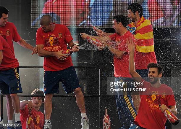 Spanish national football team players celebrate on July 2, 2012 on Cibeles Square in Madrid, a day after it won the final match of the Euro 2012...