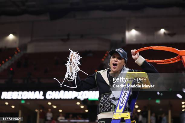 Head coach Dawn Staley of the South Carolina Gamecocks celebrates after defeating the Maryland Terrapins 86-75 in the Elite Eight round of the NCAA...