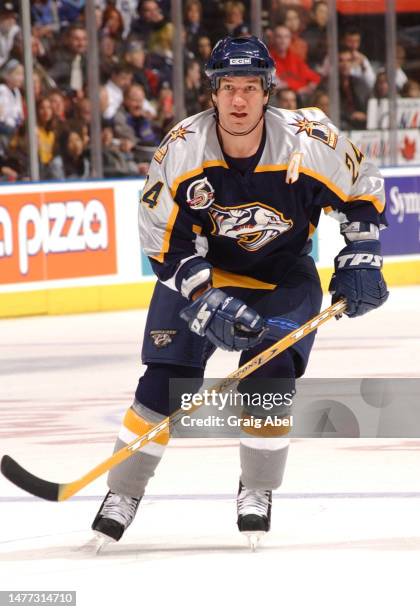 Scott Walker of the Nashville Predators skates against the Toronto Maple Leafs during NHL game action on February 23, 2003 at Air Canada Centre in...