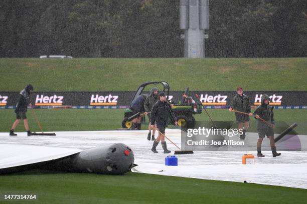 Ground staff work to remove water from the field during game two of the One Day International series between New Zealand and Sri Lanka at Hagley Oval...