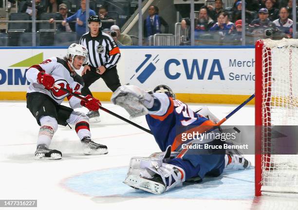 Ilya Sorokin of the New York Islanders makes the third period save on Jack Hughes of the New Jersey Devils at the UBS Arena on March 27, 2023 in...