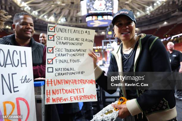 Head coach Dawn Staley of the South Carolina Gamecocks celebrates after defeating the Maryland Terrapins 86-75 in the Elite Eight round of the NCAA...