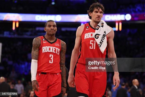 Kevin Porter Jr. #3 and Boban Marjanovic of the Houston Rockets react as they walk to the bench during a time out in the fourth quarter against the...