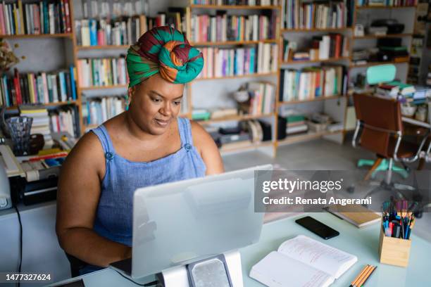 portrait of mature black woman working in the office - brazilian headdress stock pictures, royalty-free photos & images