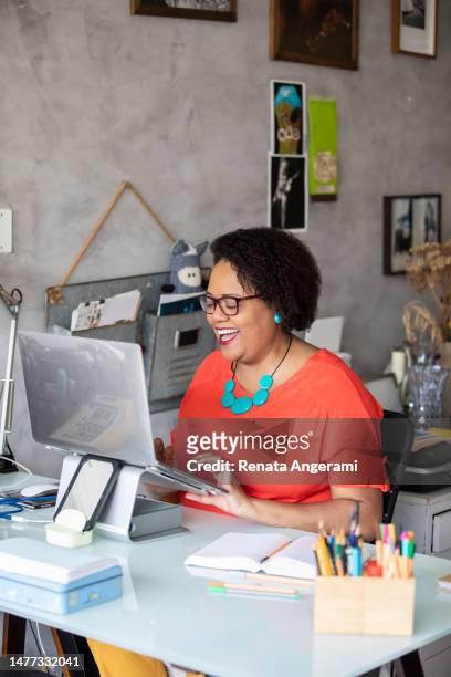 portrait of mature black woman working in the office - e learning design stock pictures, royalty-free photos & images