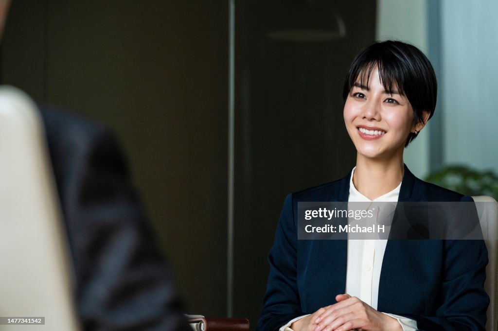 Executive interview in corporate conference room