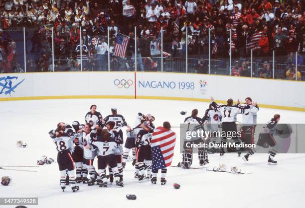 The USA Women's Ice Hockey team celebrates winning the Olympic gold medal match against Canada during the 1998 Winter Olympics on February 17, 1998...