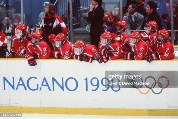 Members of the Women's Ice Hockey team of Canada watch the gold medal match against the USA during the Women's Ice Hockey tournament of the 1998...