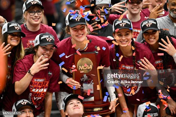 Georgia Amoore and Elizabeth Kitley of the Virginia Tech Hokies celebrate with teammates after defeating the Ohio State Buckeyes 84-74 in the Elite...