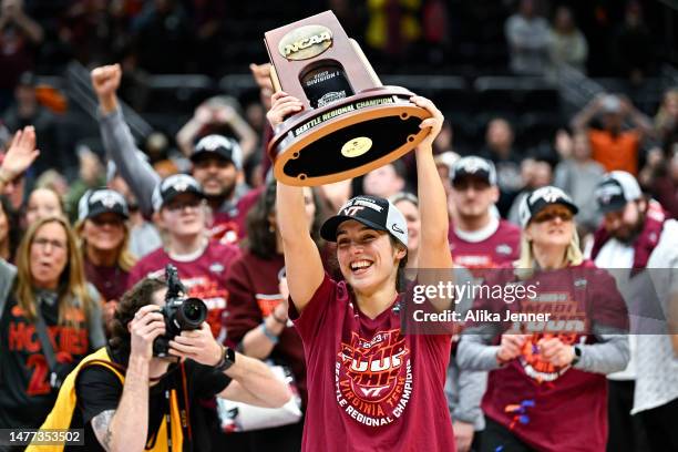 Georgia Amoore of the Virginia Tech Hokies celebrates with the trophy after defeating the Ohio State Buckeyes 84-74 in the Elite Eight round of the...