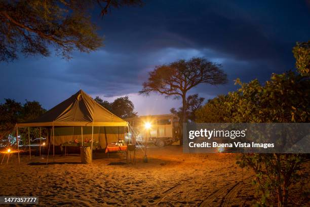 safari camp at night - chobe national park stock pictures, royalty-free photos & images