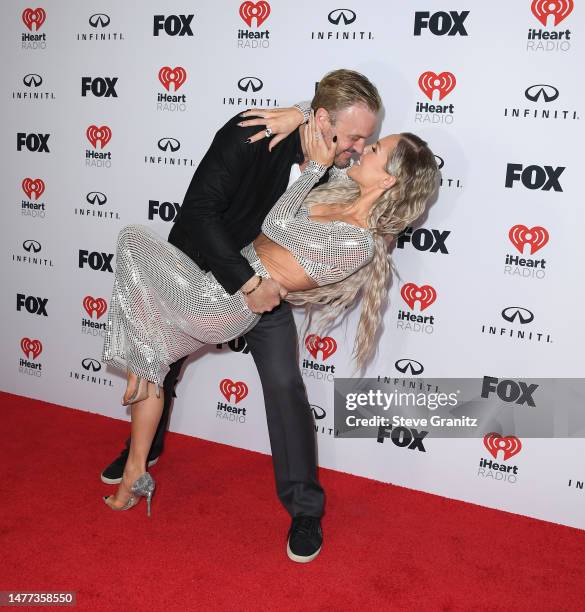 Sharna Burgess, Brian Austin Green poses at the 2023 iHeartRadio Music Awards - Press Room at Dolby Theatre on March 27, 2023 in Hollywood,...