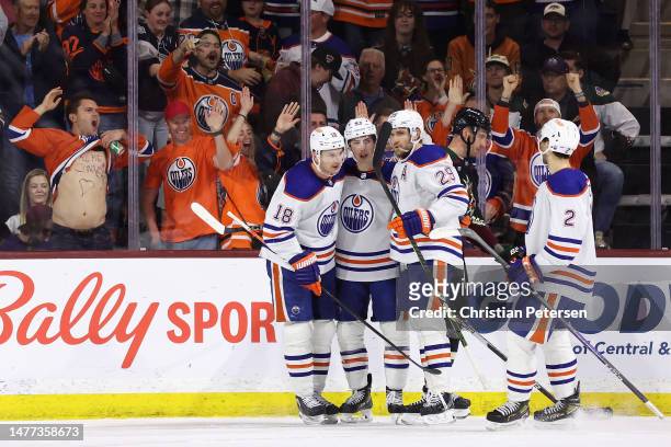 Ryan Murray, Ryan Nugent-Hopkins, Leon Draisaitl and Evan Bouchard of the Edmonton Oilers celebrate after Nugent-Hopkins scofred a power play goal...