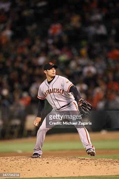 Clay Hensley of the San Francisco Giants pitches during the game against the Oakland Athletics at the Oakland-Alameda County Coliseum on June 22,...