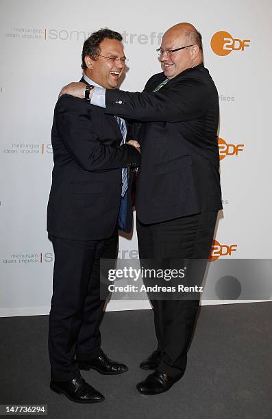 German Interior Minister Hans-Peter Friedrich and German Environment Minister Peter Altmaier attend the ZDF summer reception on July 2, 2012 in...