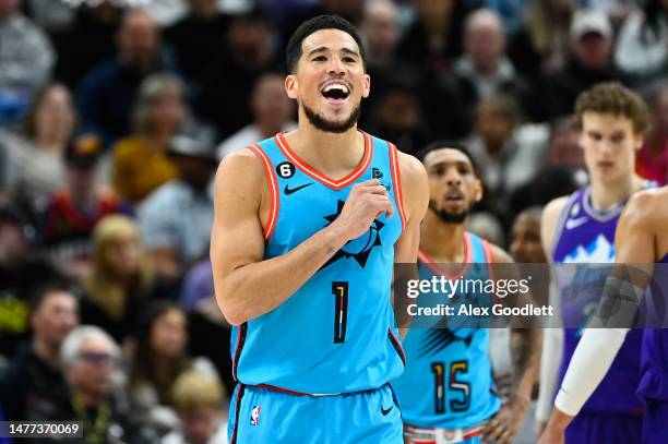 Devin Booker of the Phoenix Suns reacts to a play during the first half of a game against the Utah Jazz at Vivint Arena on March 27, 2023 in Salt...