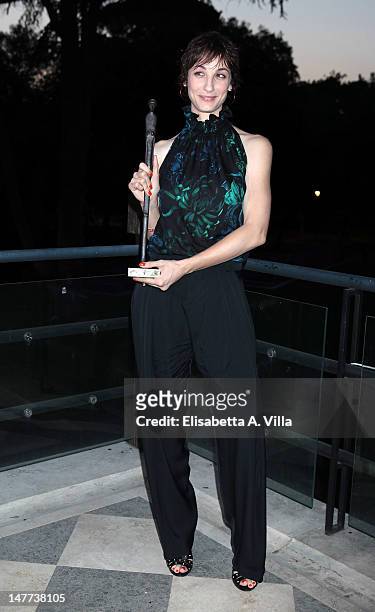Actress Francesca Inaudi shows her award during the 2012 Premio Afrodite at Casa del Cinema on July 2, 2012 in Rome, Italy.
