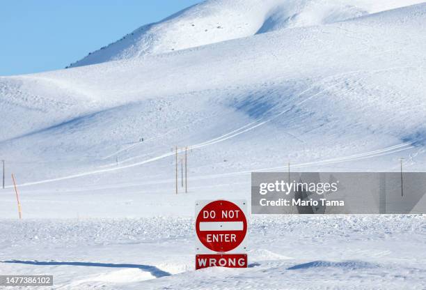 Traffic sign is partially buried in snow in the Sierra Nevada mountains, ahead of yet another strong storm system which is expected to bring heavy...