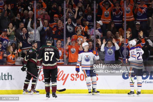 Ryan Nugent-Hopkins of the Edmonton Oilers celebrates a power-play goal with Leon Draisaitl during the third period of the NHL game against the...