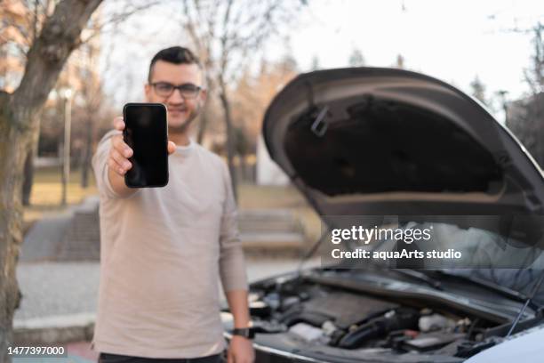 calling roadside assistance - tow truck driver portrait stock pictures, royalty-free photos & images