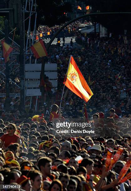 Crowds wait the arrival of the Spanish team in Cibeles square on July 2, 2012 in Madrid, Spain. Spain beat Italy 4-0 in the UEFA EURO 2012 final...