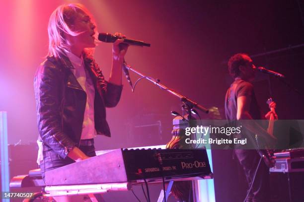 Emily Haise and Joshau Winstead of Metric performs on stage at Shepherds Bush Empire on July 2, 2012 in London, England.