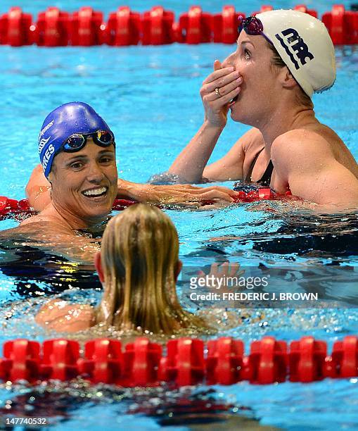 Dara Torres , who finished in fourth place turns to winner Jessica Hardy as Kara Lynn Joyce reacts to her second place finish in the women's 50M...