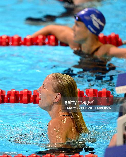 Jessica Hardy reacts to her first place finish ahead of Dara Torres , who finished fourth in the women's 50M Freestyle final on the last day of the...