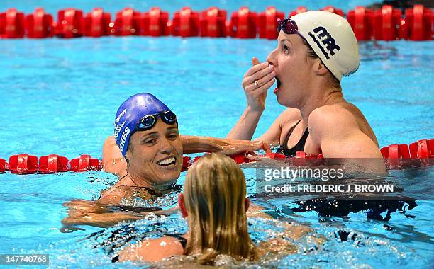 Kara Lynn Joyce reacts to her second place finish as Dara Torres , who finished fourth, congratulates winner Jessica Hardy following the women's 50M...