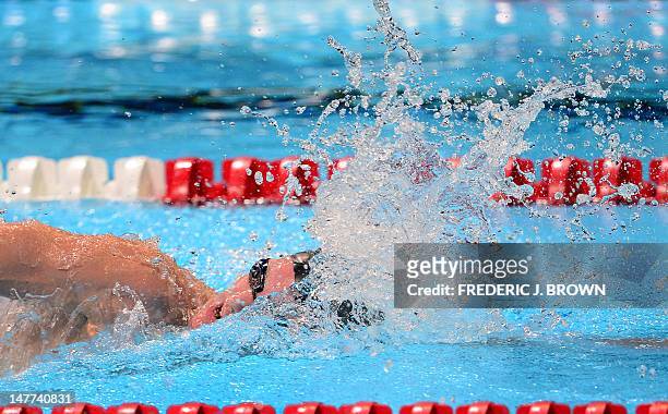 Andrew Gemmell swims to a first place finish on the last lap of the men's 1500M Freestyle final on the last day of the 2012 US Olympic Team Trials on...