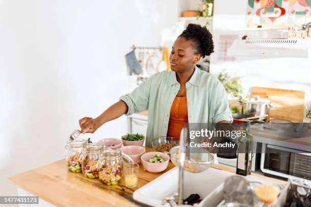 woman preparing a tasty salad in a jar - freshers week stock pictures, royalty-free photos & images