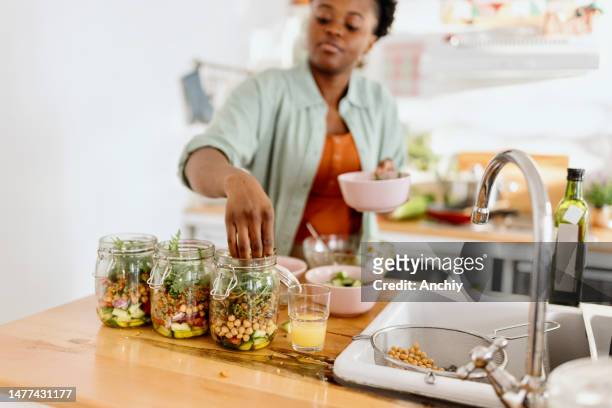 woman preparing a tasty salad in a jar - freshers week stock pictures, royalty-free photos & images