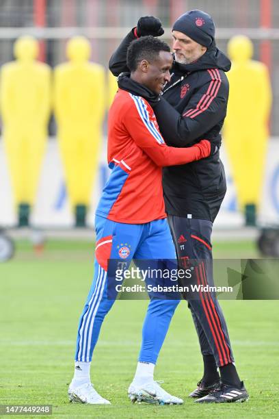 Head coach Thomas Tuchel of FC Bayern München jokes with Bouna Sarr during a training session at Saebener Strasse training ground on March 28, 2023...