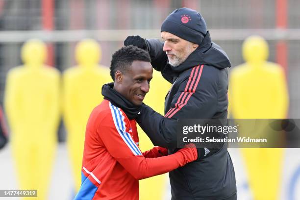 Head coach Thomas Tuchel of FC Bayern München jokes with Bouna Sarr during a training session at Saebener Strasse training ground on March 28, 2023...