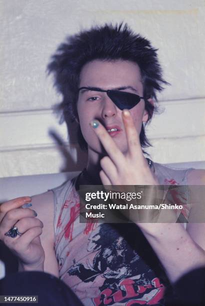 Sid Vicious of the Sex Pistols, wearing an eye patch, at his flat in London, UK, 4th August 1978.