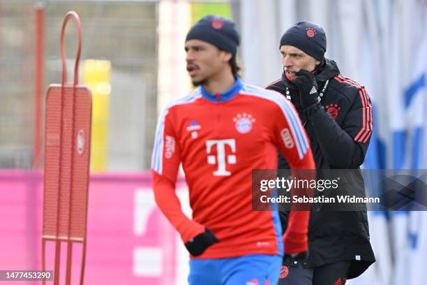 Head coach Thomas Tuchel of FC Bayern München looks on next to Leroy Sane during a training session at Saebener Strasse training ground on March 28,...