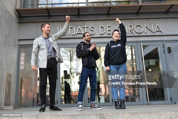 Three of the four accused for cutting the AVE tracks in the protests of the first anniversary of 1-O, from l-r , at the Girona Courts, on 28 March,...