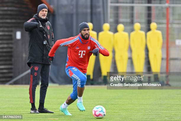 Head coach Thomas Tuchel of FC Bayern München gestures next to Eric Maxim Choupo-Moting during a training session at Saebener Strasse training ground...