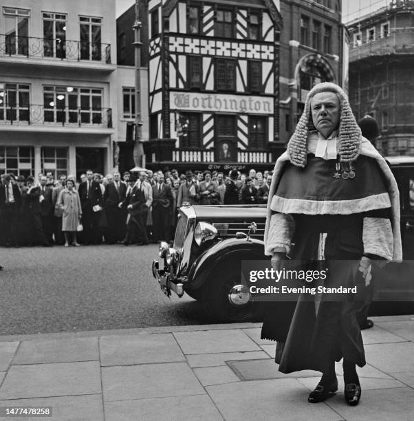 Judge Sir Melford Stevenson watched by a crowd of onlookers while entering the Royal Courts of Justice, The Strand, London, October 1st 1958.