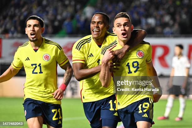 Rafael Santos Borre of Colombia celebrates after scoring the team's second goal with teammates Jhon Arias and Daniel Munoz during the international...