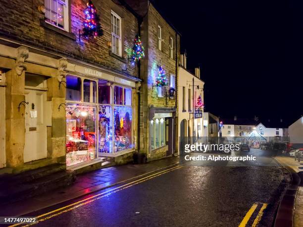 christmas lights on buildings in alston - royal blue stock pictures, royalty-free photos & images