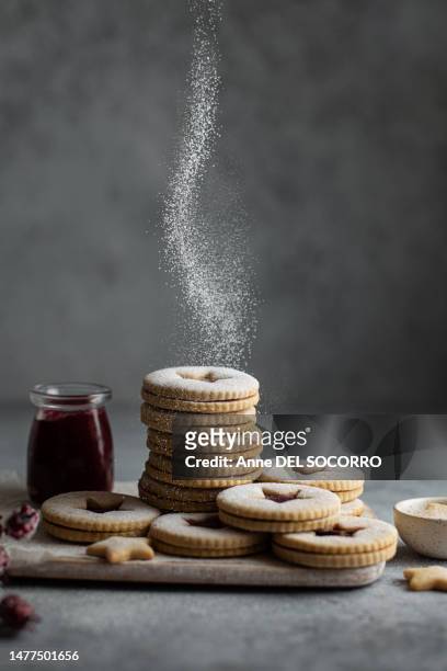 raspberry jam linzer biscuits for christmas - shortbread stock pictures, royalty-free photos & images
